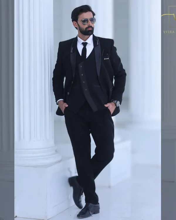 A classic black three-piece suit that exudes sophistication. This pre-loved tuxedo is perfect for a reception or formal engagement party.