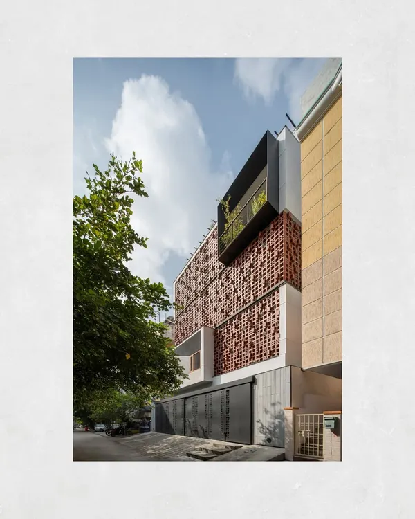 This is the Kamala Residence in Tirupati, a project that embodies our approach to urban living. The terracotta breeze block facade is not just an aesthetic choice; it's a functional element that provides privacy and thermal comfort, creating a tranquil sanctuary within a dense neighborhood.