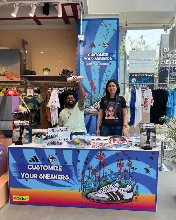 Our live customization booth, set up and ready for action at the Adidas store on Linking Road, Mumbai. We provide a fully branded and interactive art experience that draws crowds and adds a creative flair to any retail space or event.
