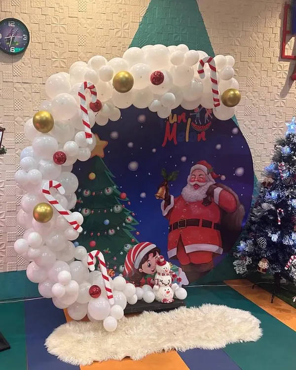 My Christmas setup is perfect for festive family photos. I create a winter wonderland with a beautiful tree, a Santa backdrop, and snowy decorations.