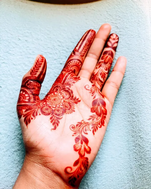 This is the beautiful, rich reddish-brown stain you can achieve with my 100% organic henna cones. I use only pure, natural ingredients to get this lovely color, without any harmful chemicals.