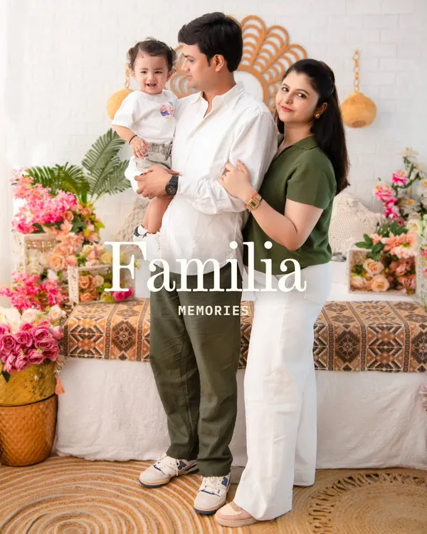 A classic family portrait that radiates warmth. I coordinate outfits and backdrops, like this bohemian floral setup, to ensure your family photo is a timeless piece of art.