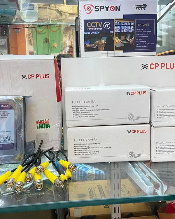 This is a standard 4-camera CP Plus Full HD setup. It includes four cameras, a 1TB Western Digital surveillance hard drive, connectors, and a power supply. Everything you need for a complete installation.