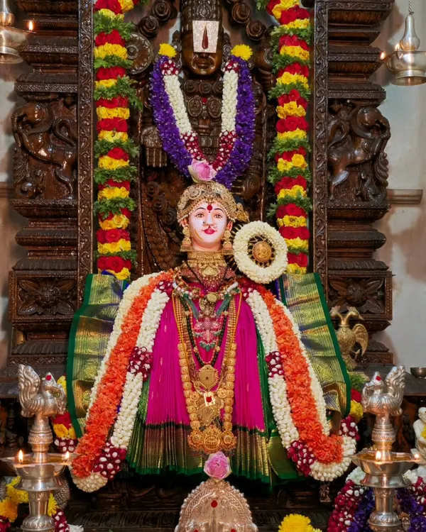 This is the result of our Varamahalakshmi pooja at home, where every detail, from the deity's alankara to the flower arrangements, is done with devotion. I guide you in creating such a divine atmosphere in your own home for the festival.