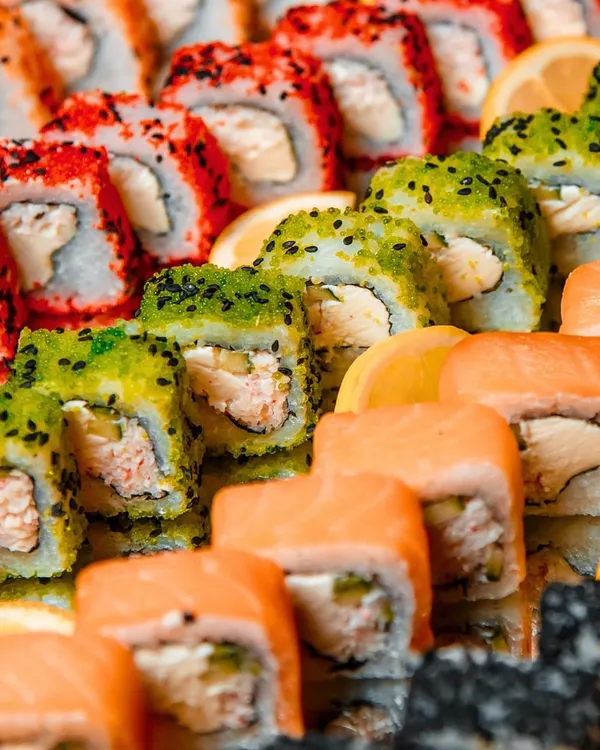 Immerse yourself in a world of exquisite flavors with our sushi station. This colorful and abundant platter showcases a variety of rolls, each crafted to deliver an unforgettable culinary experience.