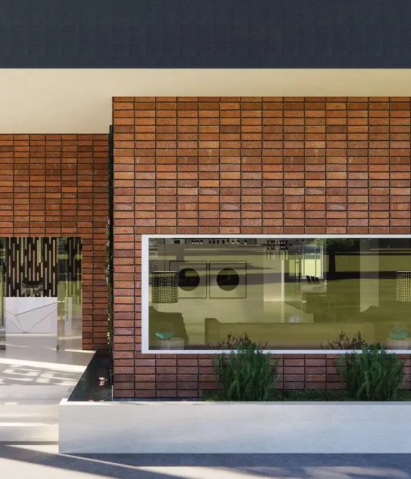 For this marketing office, I designed a facade that is both timeless and modern. The terracotta cladding will develop a beautiful patina over time, while the large window frames the interior like a picture. The screened foyer with jaalis creates beautiful moving shadows, symbolizing the ever-evolving nature of design.