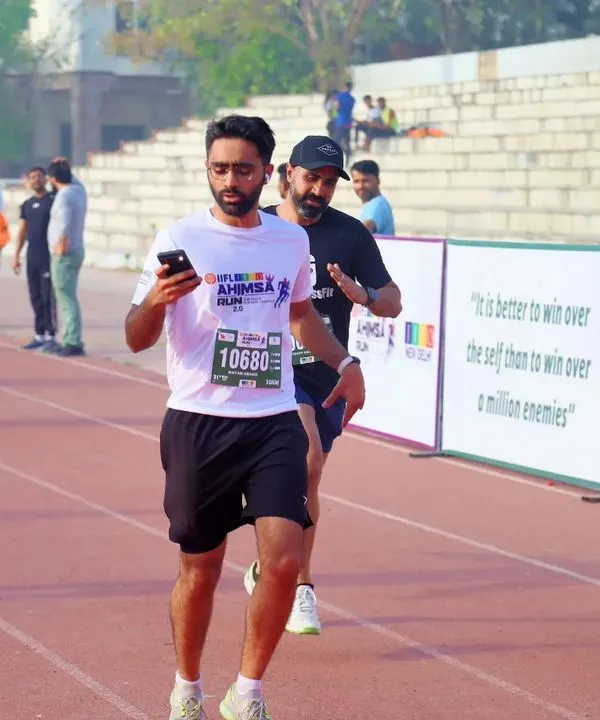 Here I am on the track during the JITO Ahimsa Run in New Delhi. This race was a personal victory, proving that consistent training pays off. My coaching focuses on building the endurance and form needed for a strong finish.