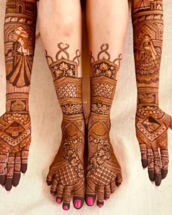 A stunning example of full bridal mehandi, with coordinated designs covering the hands, arms, and feet for a complete, breathtaking look.