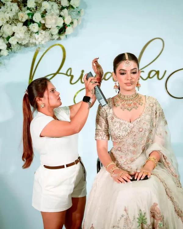 In my element, giving the final touches to a bride's hairstyle. I make sure every detail is perfect before she walks down the aisle.