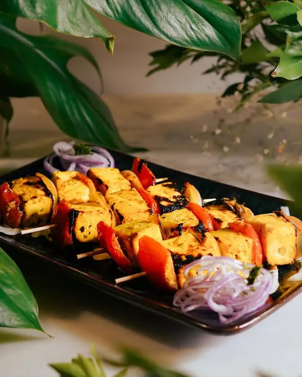 My Saffron Paneer Skewers, beautifully arranged and ready to be served. The soft paneer, marinated in fragrant spices and grilled with colorful bell peppers, is a vegetarian showstopper.