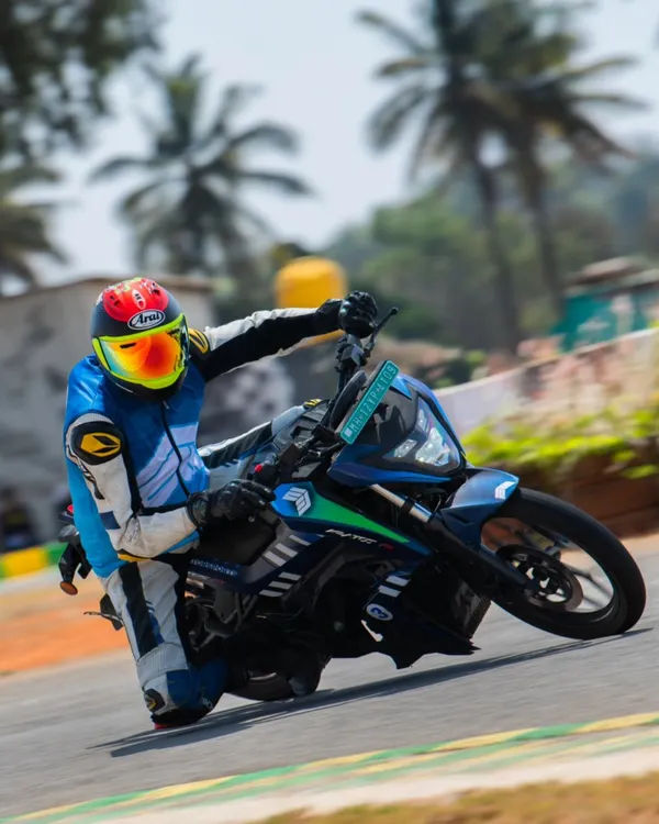 Leaning an electric race bike into a corner during a test session. As a rider coach, I help racers adapt their skills to the instant torque and different feel of EV motorcycles.