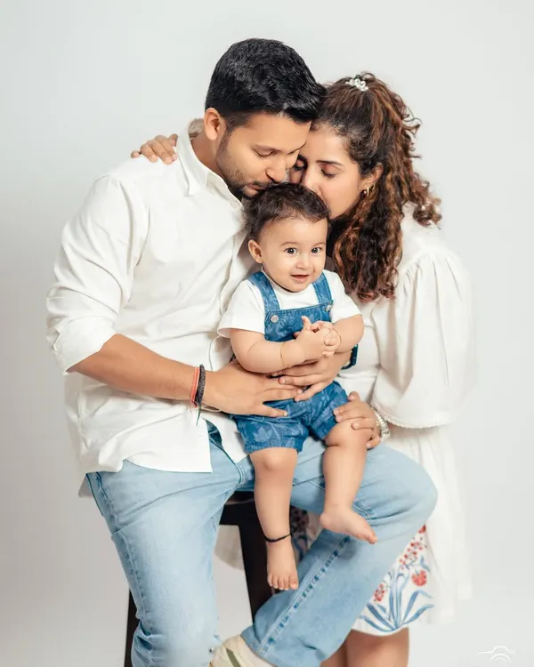 An intimate studio family portrait capturing the tender love between parents and their baby boy. We focus on creating a comfortable space for these genuine moments of connection.