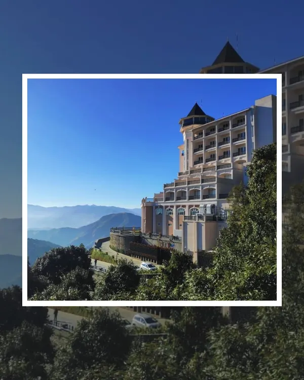 The exterior of the ITC Tavleen in Chail, a luxury resort designed to feel like a modern European castle nestled in the Shivalik ranges. The architecture is crafted to command a presence while harmonizing with the breathtaking mountain vistas.