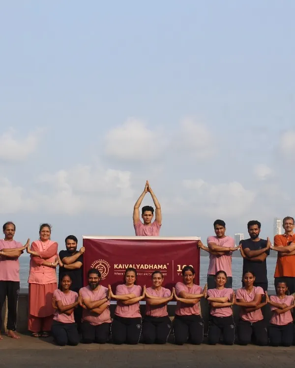 Our students gather for a group practice at Mumbai's iconic Marine Drive, near our center. We believe in creating a strong community, finding moments of shared peace and discipline amidst the energy of the city.