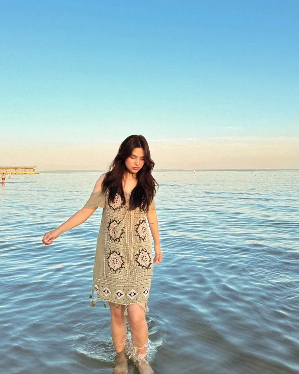 Wading into the water at Crystal Beach in a cute, bohemian-style beach dress.