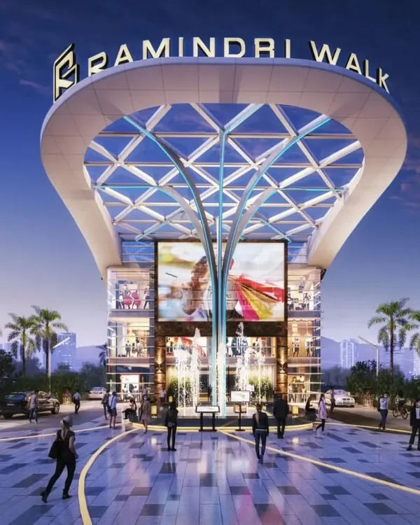 The grand entrance of Ramindri Walk in Guwahati, designed to be a hyper-connected mall. The tree-like central column and expansive glass canopy create a welcoming and impressive entry point for visitors.