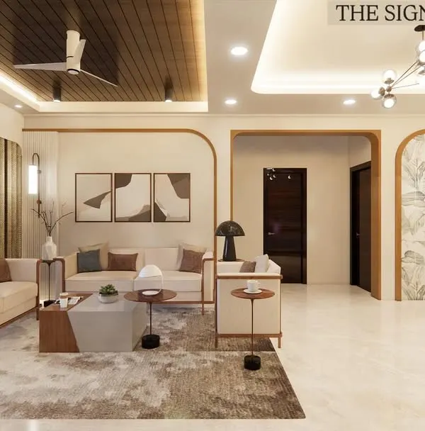 A wide view of the open-plan living and dining area at Prestige Waterford. The design uses arched doorways and consistent wood tones to unify the space while creating distinct zones for relaxing and dining.
