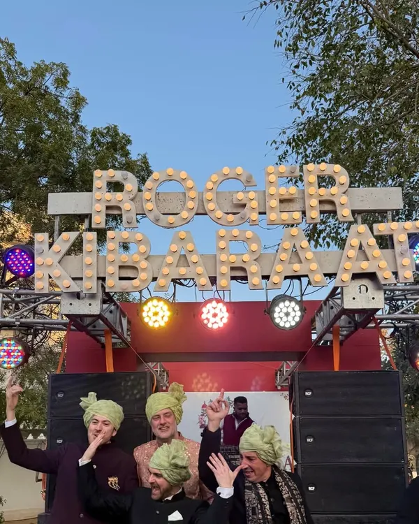 A Baraat should be an event in itself. For this wedding in Jaipur, we created a custom mobile DJ truck with a "ROGER KI BARAAT" marquee sign to make the procession feel like a festival.
