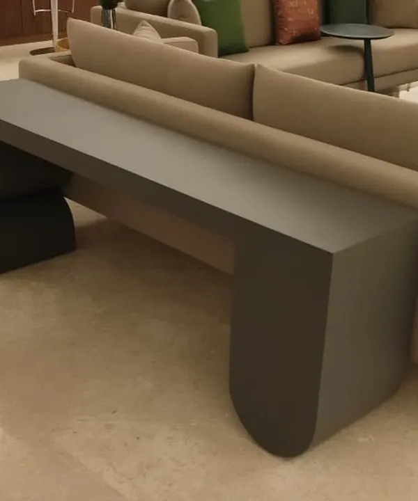 This was one of our expedited 10-day delivery projects. A sculptural console table with a minimalist, geometric design, finished in a matte grey lacquer, designed to sit perfectly behind a sofa.