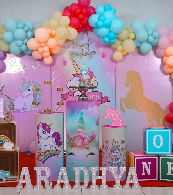 A whimsical unicorn wonderland. This pastel-themed first birthday setup shows how we capture the full scope of your party's decor.