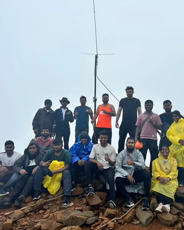 Our trekking family at a misty summit. This group conquered one of the beautiful monsoon treks in the Western Ghats, sharing ponchos and smiles.