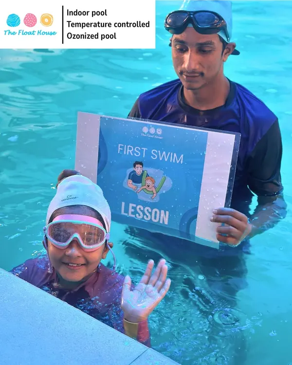 Celebrating a huge milestone. This young swimmer is all smiles after her very first swim lesson, ready for many more adventures in the water.