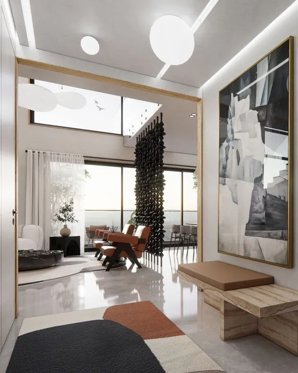 The entrance foyer of the Renaissance Bellevue penthouse in Malleshwaram. Polished floors, high ceilings, and curated art create a grand first impression, setting the tone for a home that is both elegant and simple.