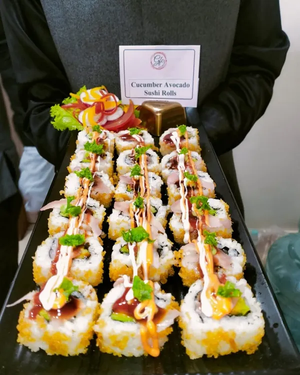 Sushi roll-call: Our Cucumber Avocado Sushi Rolls are a crowd favorite, beautifully presented and drizzled with spicy mayo and teriyaki sauce for that extra kick of flavor.
