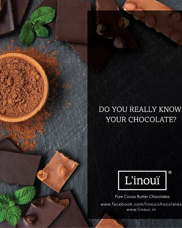 Do you really know your chocolate? We encourage you to ask. This image shows the raw elements of real chocolate: pure cocoa powder and couverture chocolate bars, the foundation of everything we create.
