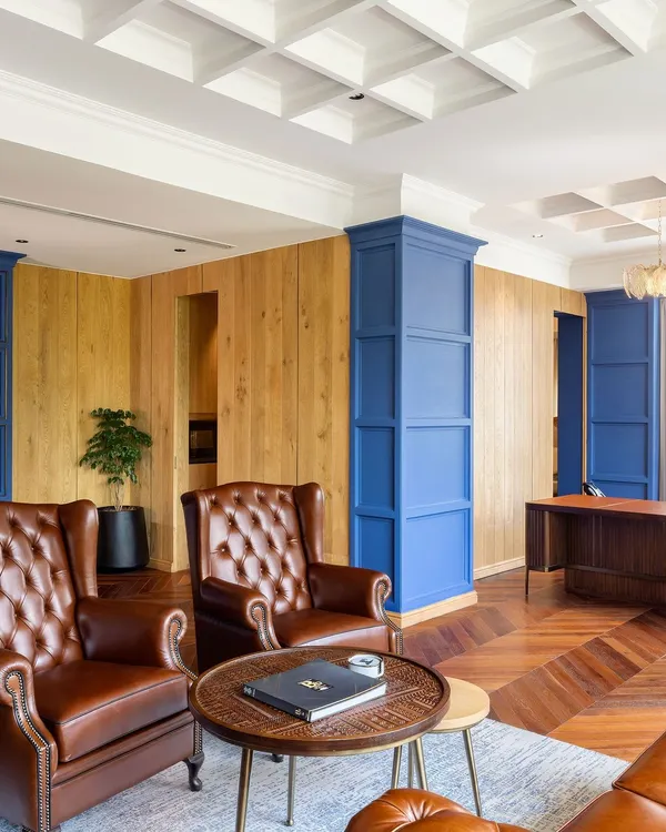 We believe in creating bespoke furniture that embodies quality and sophistication. This private office features custom wood paneling and classic leather armchairs, showcasing our ability to craft pieces that are both luxurious and timeless.