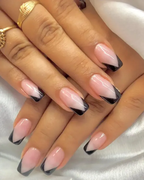 A modern take on a classic. This sharp, black V-cut French tip design on a square-shaped nail is clean, bold, and effortlessly chic.