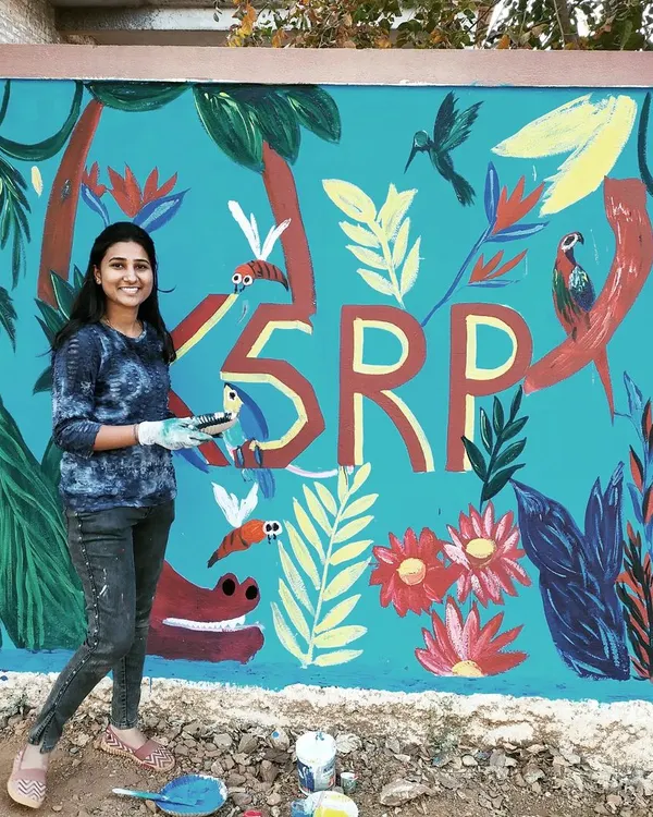 I'm so proud of this vibrant jungle themed mural we completed for the Karnataka State Reserve Police campus. The bright blue background is filled with colourful birds, flowers, and tropical leaves, creating a positive and lively environment.