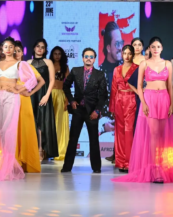 The full model lineup on stage at the "Fashion Runway of India" event. I choreograph these final walks to create a powerful visual summary of the entire collection.