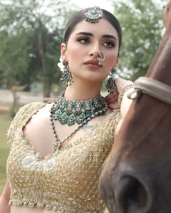 A model in stunning bridal attire poses with one of my horses. The combination of high fashion and the natural beauty of the horse creates a powerful image.
