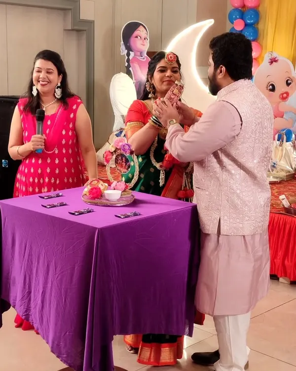 A special moment for the parents-to-be during one of our interactive games. I love creating activities that put the happy couple at the center of the celebration.