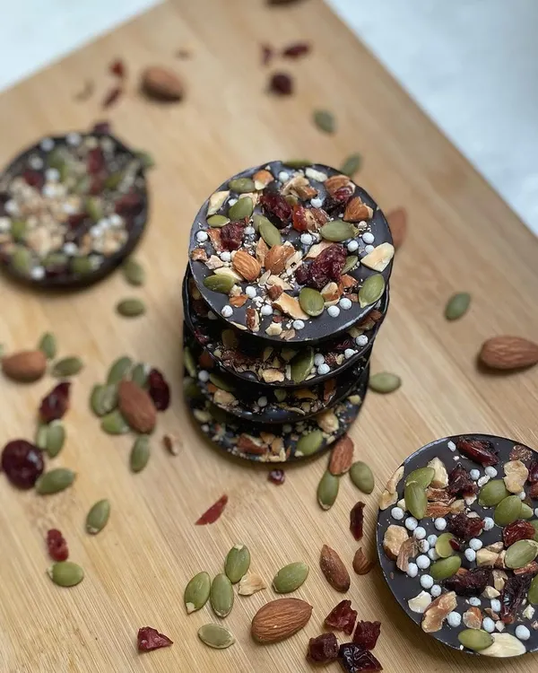 Our Almond Berry Discs are crunchy dark chocolate medallions loaded with roasted almonds, pumpkin seeds, and tangy dried cranberries. A healthy and delicious treat.