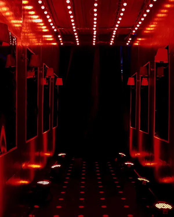 The 'Red Pill' path within our Matrix-themed tunnel experience. We used dramatic red uplighting and repeating floor lights to create a bold, high-energy corridor for guests at the EO Noida President's Gala.