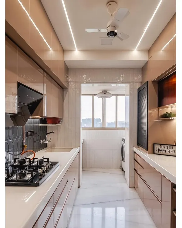 This is a full view of a sleek, modern galley kitchen. I used high-gloss cappuccino-colored acrylic cabinets for a seamless look, paired with a durable white countertop. The linear lighting on the ceiling illuminates the entire workspace effectively.