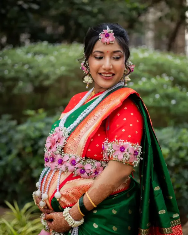 This is what the pregnancy glow looks like. I captured this beautiful mom-to-be during her traditional Maharashtrian baby shower, complete with stunning floral jewellery that highlights her joy.