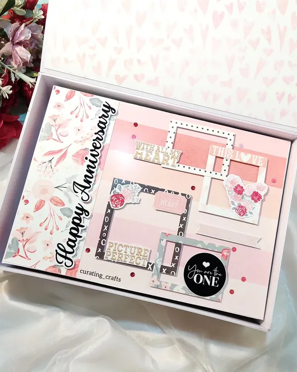 I was honored to create this huge A4 scrapbook for a couple celebrating their 25th wedding anniversary. The cover is designed with elegant floral patterns and multiple frames to begin their story.