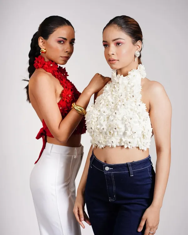 For this e-commerce shoot, I styled two models in floral appliqué halter tops. The pairing of a red top with white pants and a white top with dark denim shows the versatility of the collection.