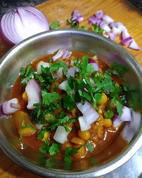 I packed off batches of this Narkol diye Ghugni, a yellow pea curry with coconut, hoping it would drum up nostalgia of Calcutta's 'melas' for my patrons. It's a spicy, comforting snack, perfect for a chilly day.