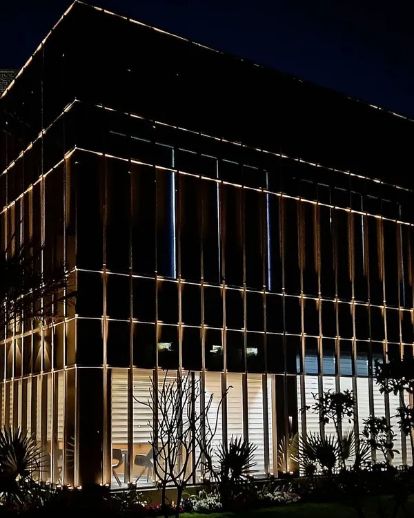 The full facade of a commercial office block in Zirakpur, where I used integrated linear lighting to emphasize its modern, glass-paneled structure. The lighting gives the building a professional and high-tech identity.