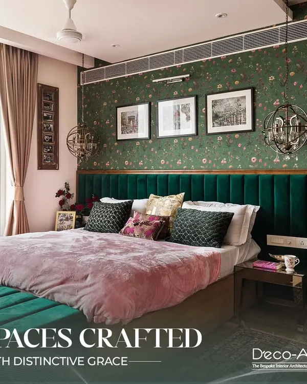 This bedroom is crafted with distinctive grace, featuring a deep green velvet headboard against floral wallpaper. The design creates a luxurious staycation feel, perfect for unwinding in style.
