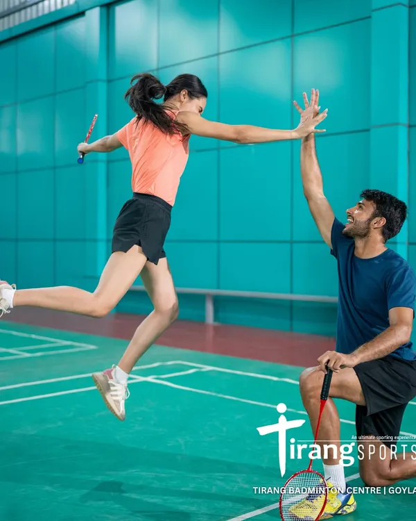 This high-five in mid-air captures the energy and joy we see on our courts every day. This professional shot was taken at our Goyla Vihar center for a Canva photoshoot, showcasing our world-class facility.