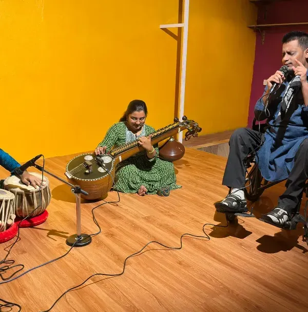 Here at Karmasthan, our stage is a platform for every kind of talent. This was a magical evening featuring an inclusive classical music performance, with a musician in a wheelchair sharing his voice alongside artists on the tabla and veena, showing how art unites us all.