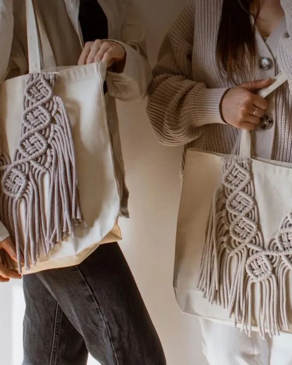 My eco-friendly tote bags are perfect for when you need a little extra space. I take a simple cotton tote and add my own unique macrame designs, like this "DNA wala" pattern, to make it special.