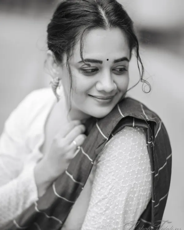 A classic black and white portrait of Spruha Varad, capturing a moment of quiet elegance during our purple saree series shoot.