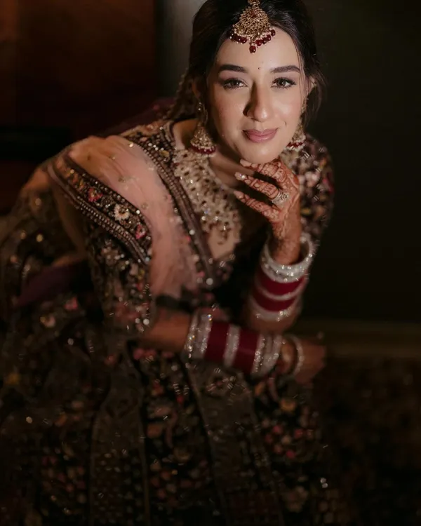 A stunning close-up portrait of the bride, her gentle smile and beautiful makeup creating a look of pure elegance.
