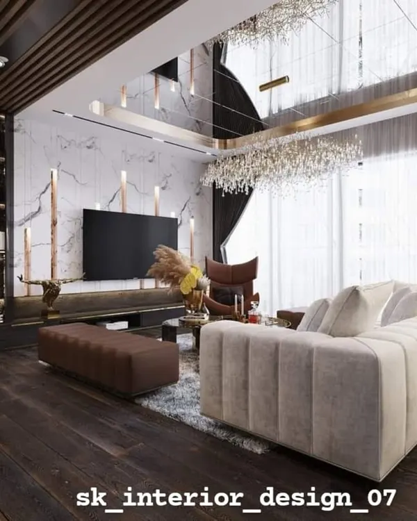 A breathtaking living room design featuring a dark wood floor and a stunning mirrored ceiling that reflects the custom chandelier, amplifying light and luxury. We used a mix of textures, from the plush sofa to the marble TV wall with an integrated bookshelf, to create a rich, layered interior.